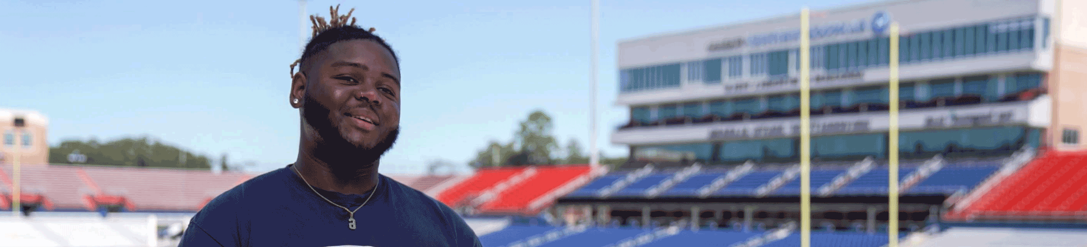 Communication student on South's football field.